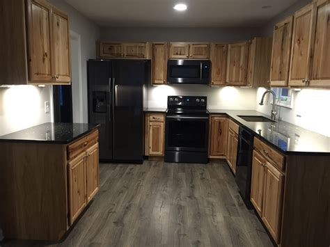 hickory cabinets with black appliances